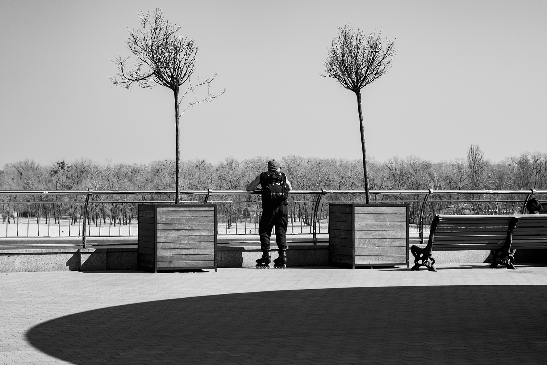 man on roller skates b&w photo